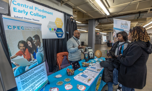  A family talks with a representative from Central Piedmont Early College.